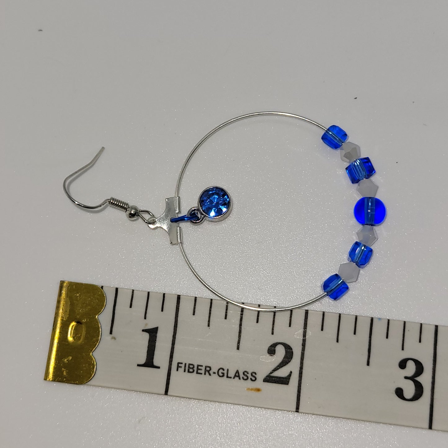 Handcrafted with recycled beads--Blue & white beads, blue jewel 2 inch dangle silver toned earring.