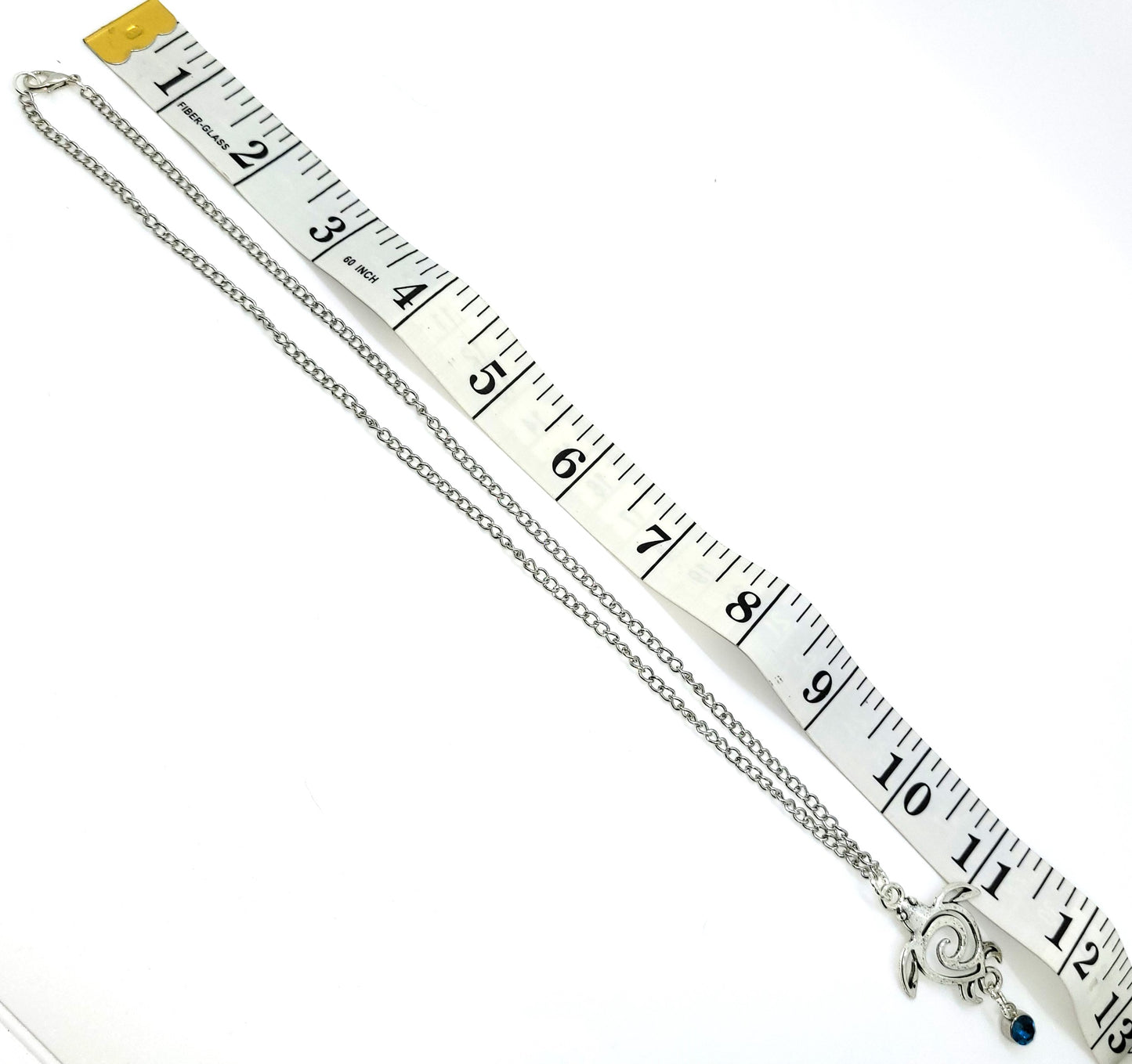 Handcrafted Silver toned Turtle charm necklace & earring with turquoise colored dangle jewel,