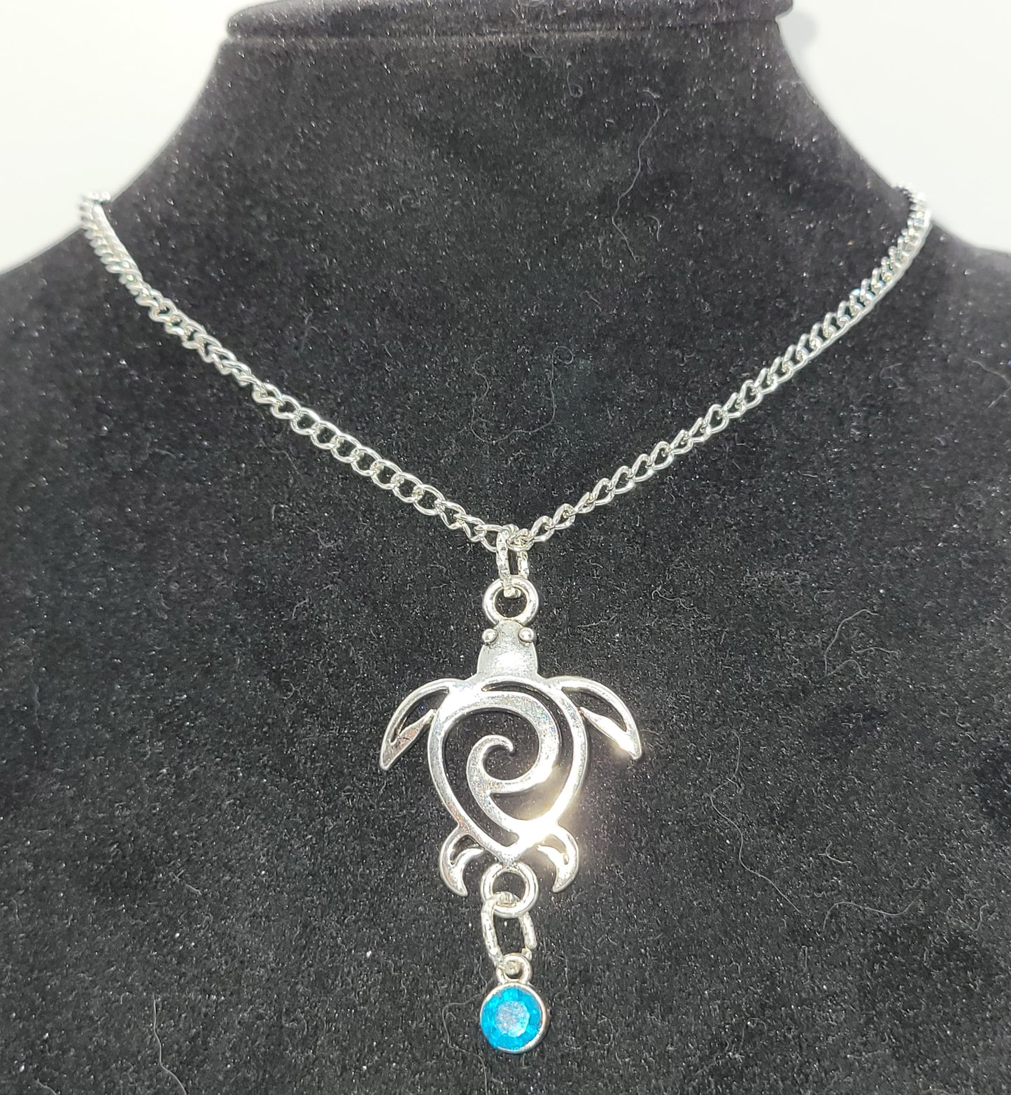 Handcrafted Silver toned Turtle charm necklace & earring with turquoise colored dangle jewel,