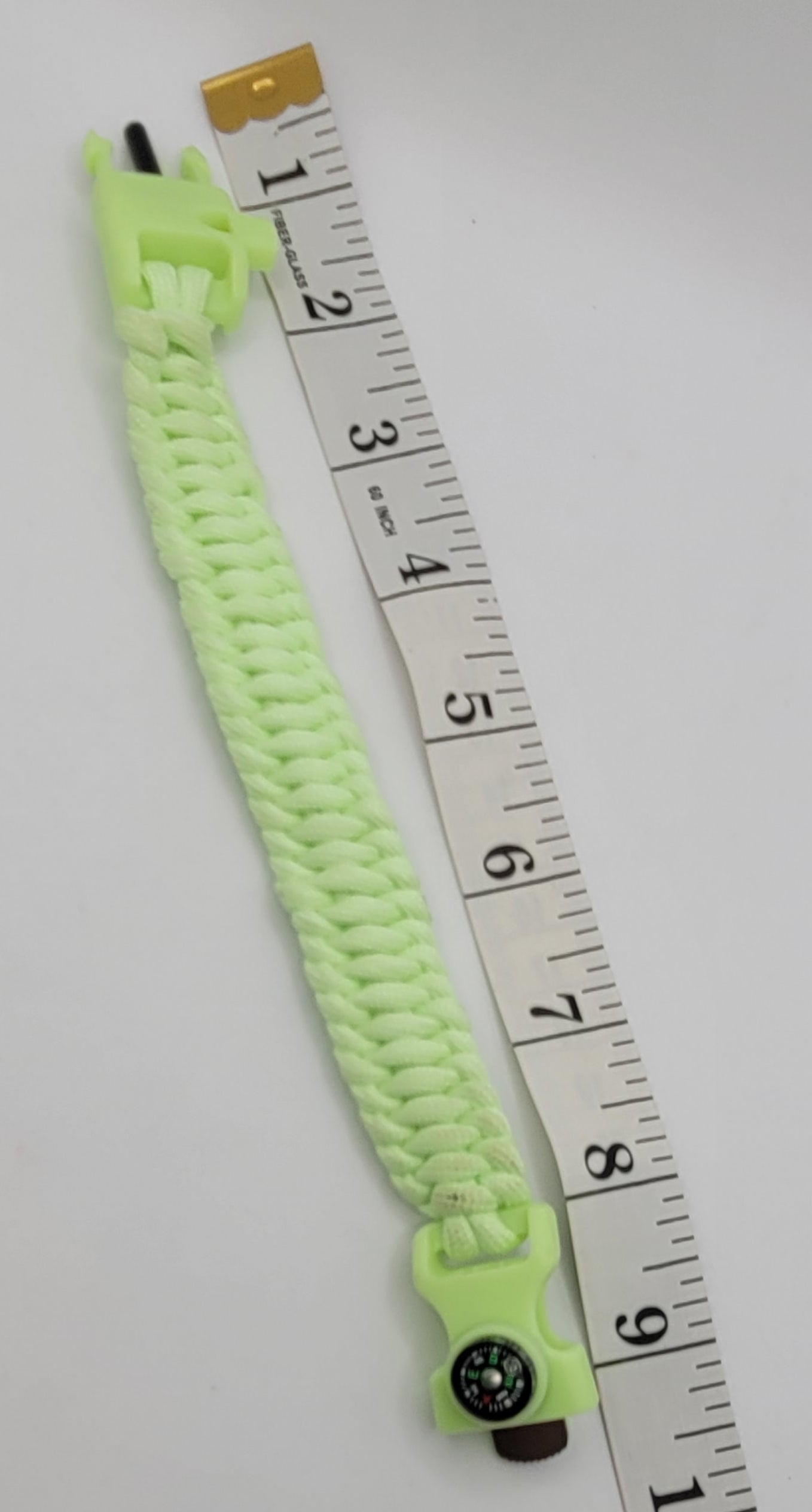 The Glow In Dark green paracord bracelet with a tool Buckle.