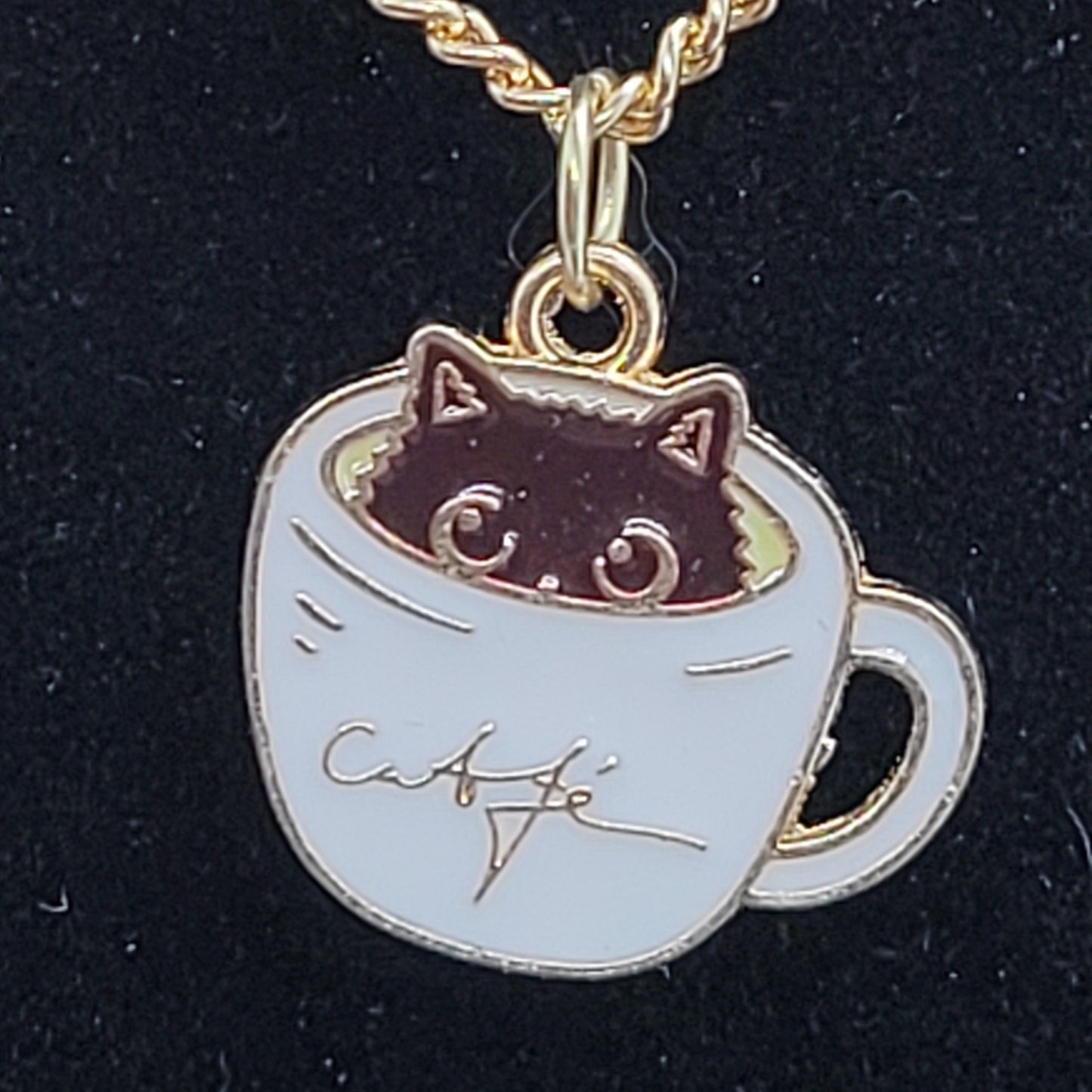 Black cat peeking out of white cup of coffee, Handcrafted Dangle earring, bracelet, necklace set, gold toned.